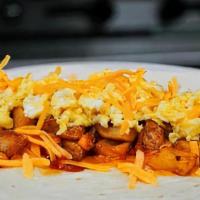 Breakfast Burrito · Scrambled egg, potatoes, and cheddar cheese, topped with hot sauce, and wrapped in a flour t...