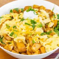 Breakfast Salad · Egg your way with potatoes and cheddar cheese on top of a bed of arugula topped with sour cr...