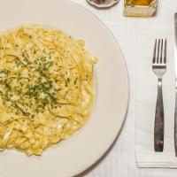 Fettuccine Alfredo · Fettuccine noodles tossed with our homemade creamy alfredo sauce.