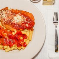 Chicken Parmigiana · Perfectly seasoned and baked chicken breast on a bed of spaghetti or rigatoni and topped wit...