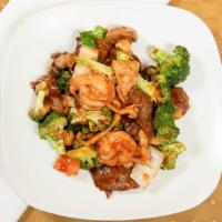 Triple Delight · Chicken, shrimp, and beef with broccoli and other mixed veggies in a brown sauce