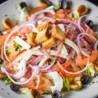 Metairie Salad · Crisp greens, salami, ham, provolone, cheddar, olives, and tomato. Add chicken or shrimp opt...