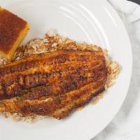Blackened Catfish · Over rice, with cornbread and your choice of fries or red beans and rice.