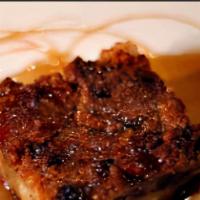 Cranberry Wheat Bread Pudding · Sweet and delicious bread pudding kissed with bourbon glaze