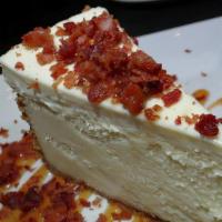 Bacon Cheesecake · Topped with bacon syrup, crumbles, caramel and our whiskey sauce