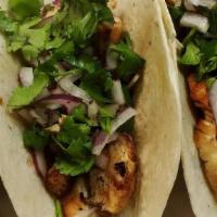 Chicken Fajita Tacos (2) · Seasoned grilled chicken with sauté peppers and onions served with side salsa.