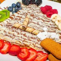 Ashur Crêpe · Crêpe, nut, banana, pineapple, kiwi, strawberry with three type of chocolate (Sweet, White, ...