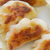 Fried Dumplings (8) / 锅贴 (8) · 8 pieces.
