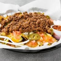 Nachos Supreme · Choice of protein, lettuce, tomatoes, sour cream, raw onions, jalapenos, cheese, and salsa o...