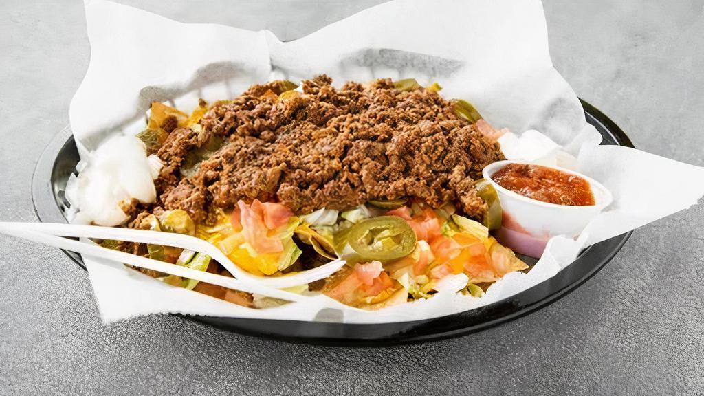 Nachos Supreme · Choice of protein, lettuce, tomatoes, sour cream, raw onions, jalapenos, cheese, and salsa on side.