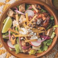 Grilled Chicken Casera Salad · A bed of romaine lettuce topped with grilled chicken, pico de gallo, cotija cheese, radishes...