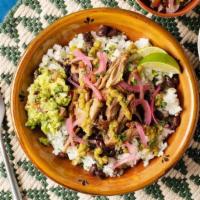 Build Your Own Burrito Bowl · A bed of cilantro-lime rice topped with black beans, cheese, lettuce, and sour cream. Make i...
