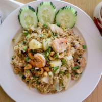 Pineapple Fried Rice · Shrimp | Chicken | Pineapple | Onions | Scallions | Cashew Nuts | Tomatoes | Raisins | Soy S...