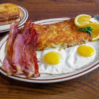 Bacon & Eggs · Four slices of bacon with two eggs any style, served with four buttermilk pancakes.