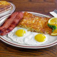 German Sausage & Eggs · One large German sausage split down the middle and grilled with two eggs any style, served w...