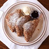 Triple Crunch French Toast · Three 1/2 slices of Texas egg bread French toast dipped in pancake batter, encrusted in a bl...