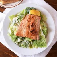 Blackened Salmon Caesar · Grilled blackened salmon on a bed of romaine lettuce with grated Parmesan cheese. Served wit...