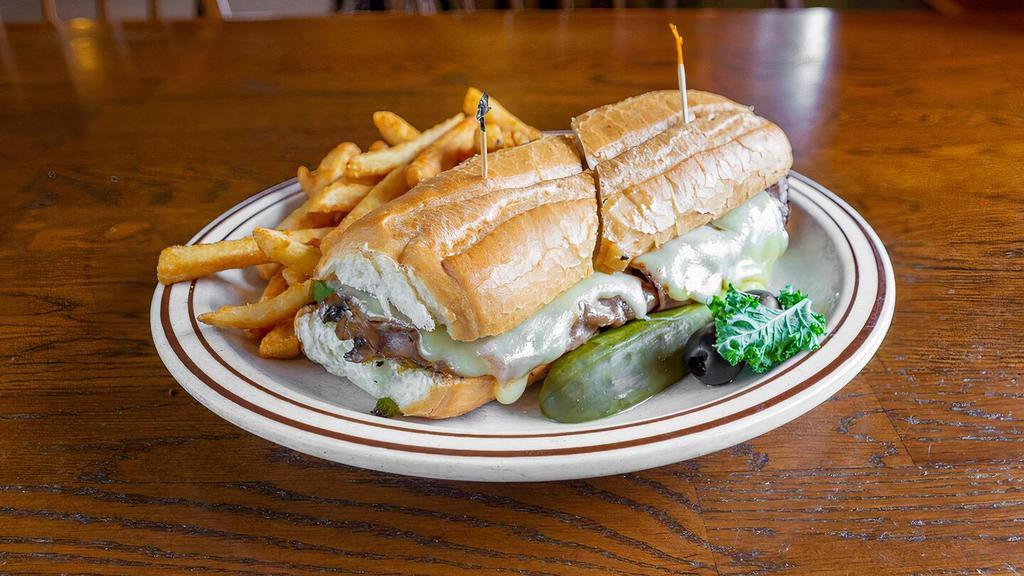 Park City Sandwich · Roast beef and melted Swiss cheese with sautéed mushrooms, green peppers, and onions on a French bun served with au jus.