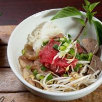 Pho Dac Biet- Combo Pho · Sliced eye round steak, well done flank steak, well done brisket, soft tendon, meatball and ...