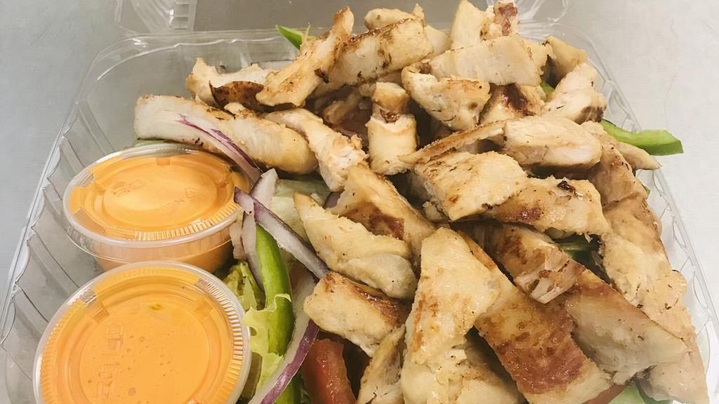 Grilled Chicken Salad · Freshly prepared grilled chicken over fresh salad with one dressing cup.