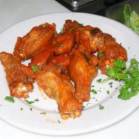 Jumbo Wings · Choice of Buffalo, BBQ, Teriyaki or Caribbean Style. Served with blue cheese or ranch dressi...