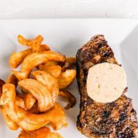 Ny Strip Steak · 12oz All-natural black angus, sidewinder fries, maitre d’ hotel butter.
