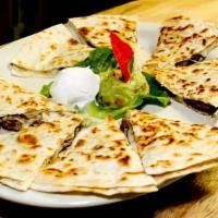 Chicken Fajita Quesadilla · Large flour tortilla filled with Jack cheese and chicken fajita. Served with sour cream and ...