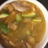 Tortilla Soup · Shredded chicken in a savory broth topped with tortilla chips, cheese and avocado slices. Se...