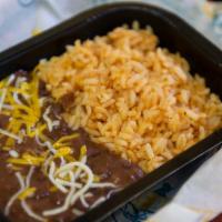 Kids Rice & Beans · Kids rice and beans with chips or a cookie and kids drink or milk.