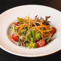 Insalata Partenope · Field greens, carrot, cherry tomato, and parmesan with balsamic vinaigrette.