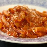 Penne Alla Amatriciana · *spicy* penne pasta, tomato sauce, pancetta, onion, crushed red chili