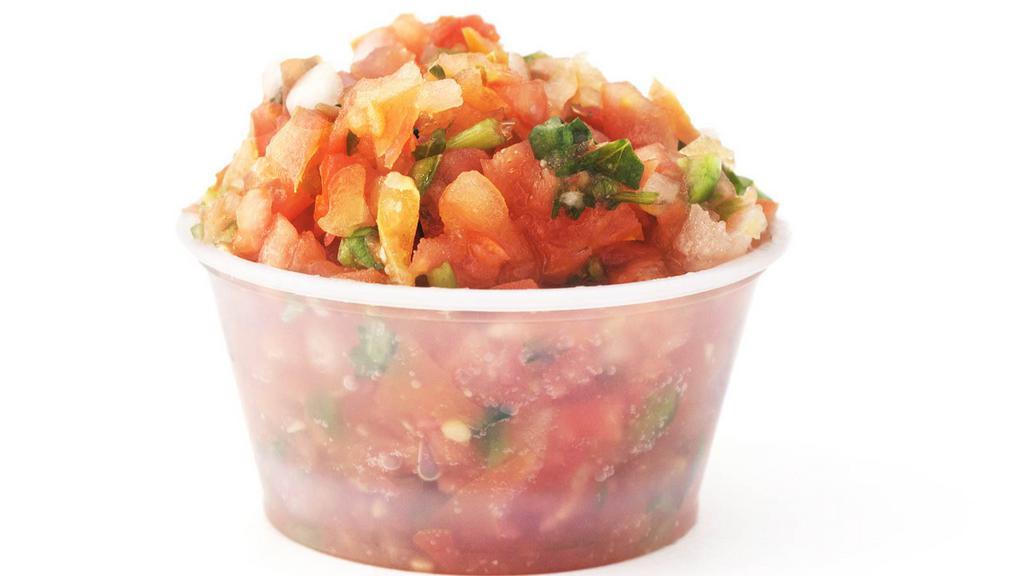 Pico De Gallo · A vibrant mix of delicately chopped onions and tomatoes topped with fresh cilantro and lime.