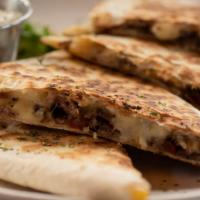 Carne Quesadilla · Fresh tender ribeye marinated in our Mexican seasoning, with Monterey Jack cheese, classic v...