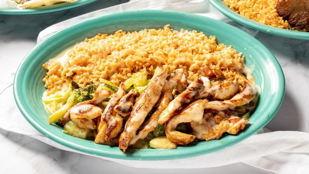 Arroz Con Pollo (Acp) · Grilled chicken and vegetables served over rice. Topped with cheese dip. Served with flour tortillas.