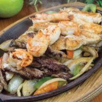 Steak, Chicken & Shrimp · Steak ,choicken and grilled shrimp cooked with grilled bell peppers, onions and tomato. Serv...