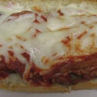 Eggplant Parm · Fired eggplant covered in house made red sauce and melted mozz cheese blend.