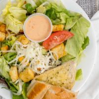 House Salad · With lettuce, tomato, onions, croutons, cucumbers & mozzarella.