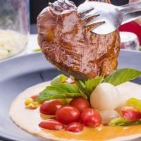 Red Curry Roast Duck · Roasted duck in traditional red curry with cherry tomatoes, bell peppers, Thai basil, grapes...