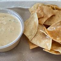 Chips & Queso · Roasted poblano queso with option to add brisket for $3
