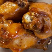 Smoked Chicken Wings · 6 smoked and fried wings with choice of sauce