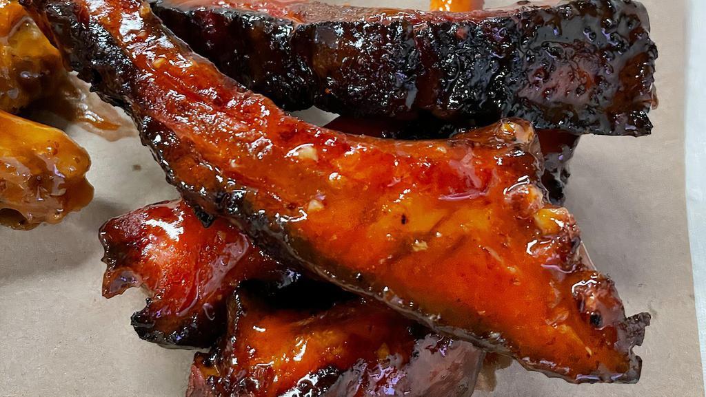 Baby Back Rib Wings · 4 smoked baby back ribs, deep fried and tossed in your choice of wing sauce, or not