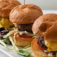 Cheeseburger Sliders · Three sliders made with freshly ground filet mignon and rib-eye with melted american cheese,...