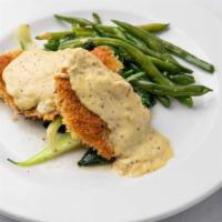 Rosemary Chicken · Lightly breaded rosemary chicken served over sautéed spinach and baby bok choy, topped with ...