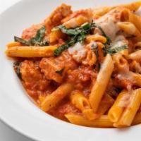 Penne Ala Vodka With Chicken · Penne with a spicy tomato vodka cream sauce, topped with grilled chicken.