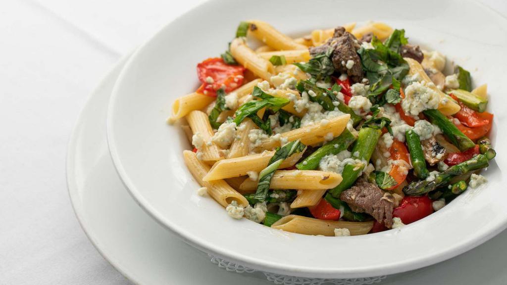 Filet Mignon Pasta · Penne with asparagus, mushrooms, red peppers and filet mignon with a garlic butter sauce and served over angel hair.