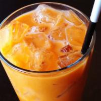Classic Thai Iced Tea · Classic Thai iced tea, topped with milk |  ICED