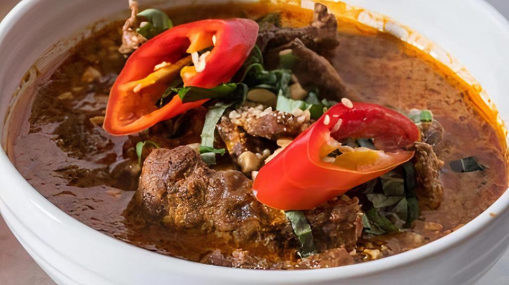 Beef Penang · Beef sautéed in spicy red curry sauce with basil leaves & kaffir lime leaves.
