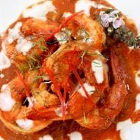 Shrimp Penang · Large gulf shrimps sautéed in spicy red curry with basil leaves & kaffir lime leaves.