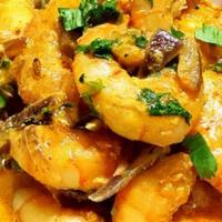 Curry Shrimp · Large shrimp sautéed in spicy yellow curry sauce with onion and scallion.