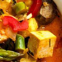 Curry Tofu · Tofu sautéed in spicy yellow curry sauce with onion and scallion.